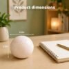 Soft pink NeeDoh Snowball sitting on a desk — Image 6 of 6