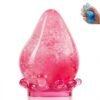 Blue NeeDoh Dream Drop raindrop squish toy resting on its clear splash-shaped stand — Image 2 of 7
