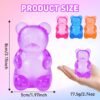Blue jelly NeeDoh Gummy Bear Taba Squishy being squeezed — Image 9 of 11