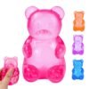 Blue jelly NeeDoh Gummy Bear Taba Squishy being squeezed — Image 4 of 11