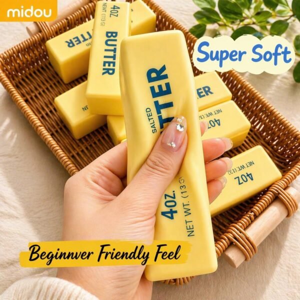 Hand holding a NeeDoh Butter Squishy realistic slow-rise butter stick toy — Image 4 of 11